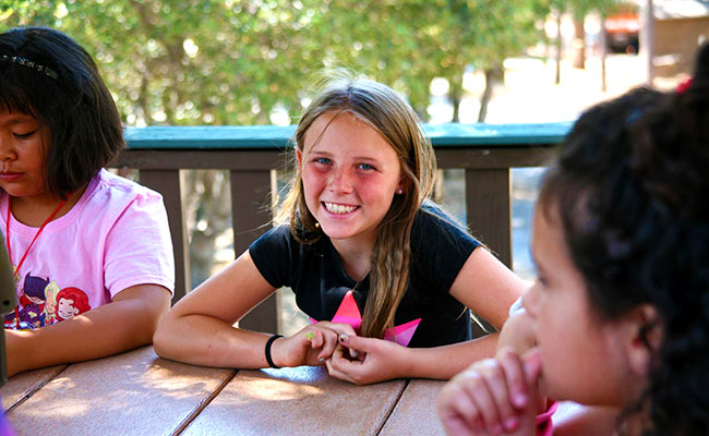 girl sitting at table